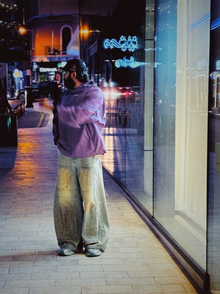 A man wearing outfits styled by invisible- men's clothing store